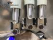 Llenadora rotativa gravimtrica de acero inoxidable con cabina