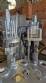 M�quina rotativa de acero inoxidable para llenado, dosificaci�n y sellado, con junta de aluminio, para tarros, vasos y botellas Delgo.